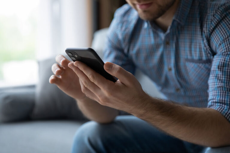 Youturn article featured image of man using mobile phone
