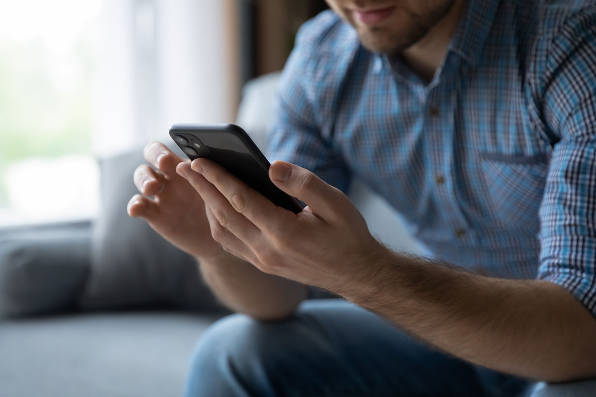 Youturn article featured image of man using mobile phone