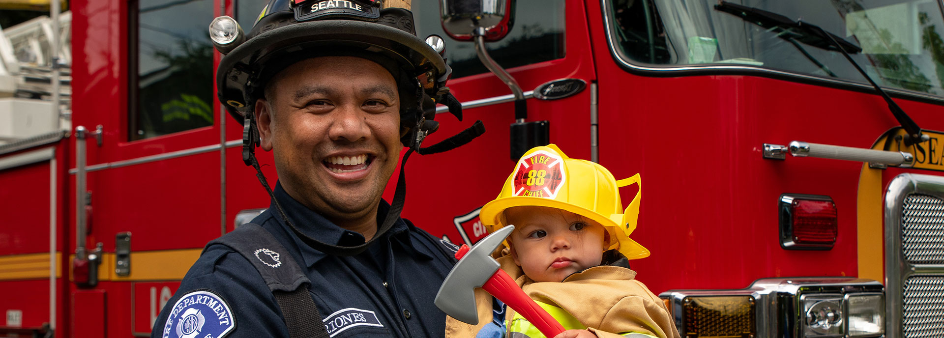 Firefighter and baby firefighter with axe