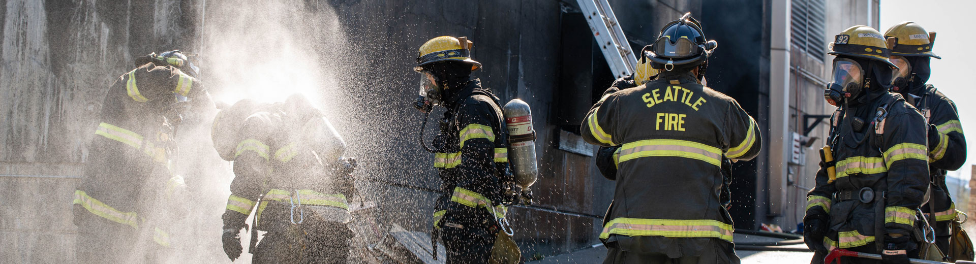 firefighters spraying off contaminants.